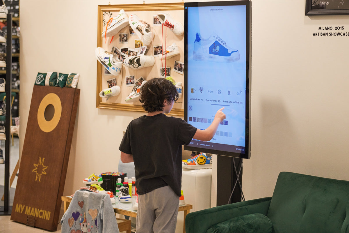 Person interacting with a large screen in a casual indoor setting